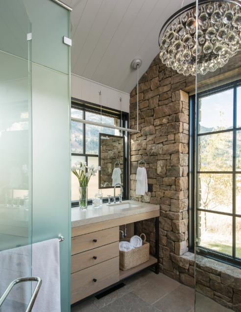 Elegant bathroom with stone walls