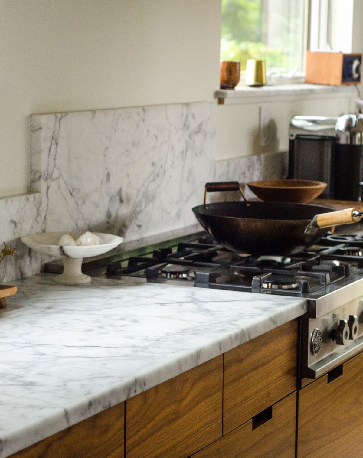 A marble backsplash with Carrara marble countertops