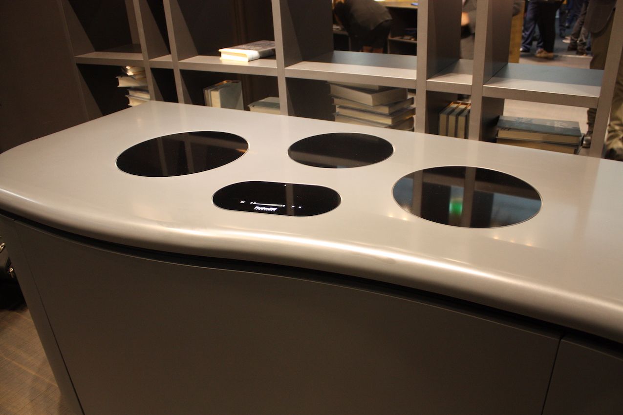 Aran's induction cooktop has designated burner areas that are sleek and modern.