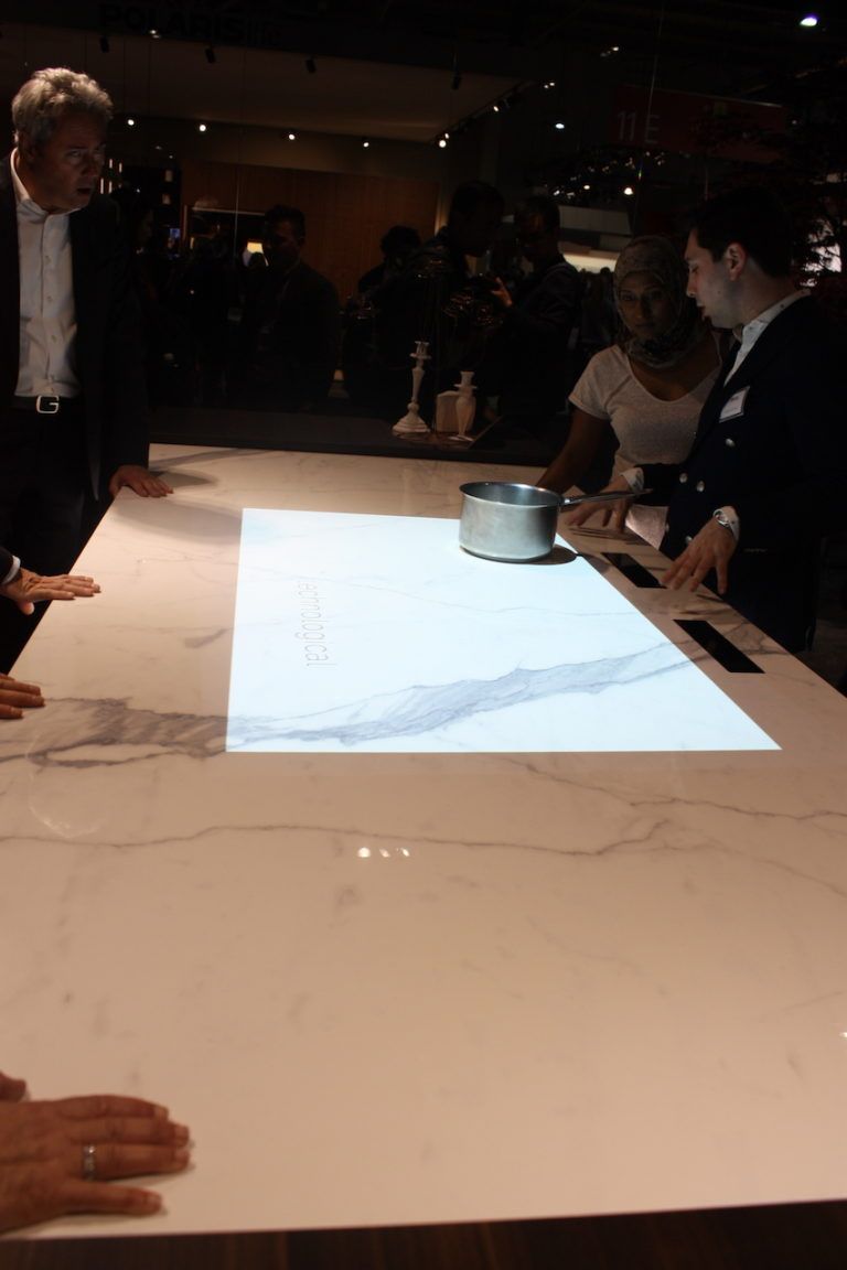 Binova has another version of the invisible cooktop that looks like a marble island.