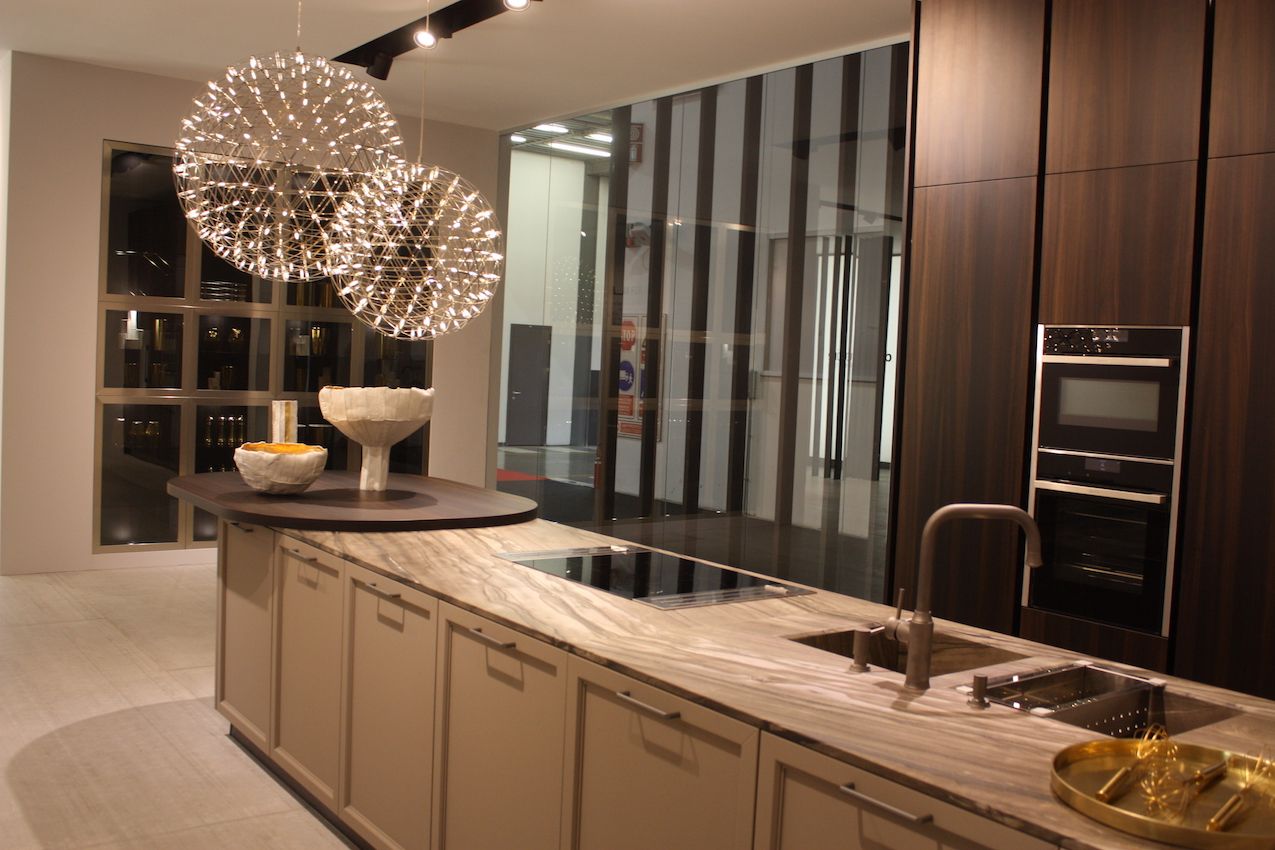Doimo's off-center placement of the airy ball lights over the counter adds a dramatic punch.